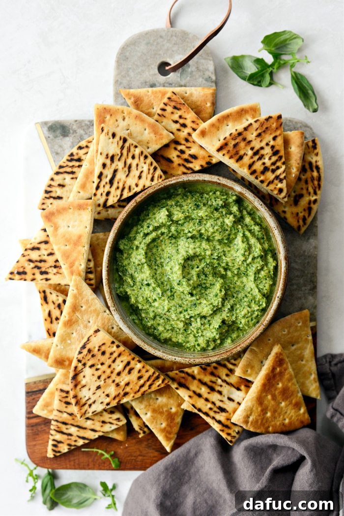 Creamy Artichoke Arugula Dip 2 Arugula Artichoke Dip served with toasted pita and fresh vegetables.