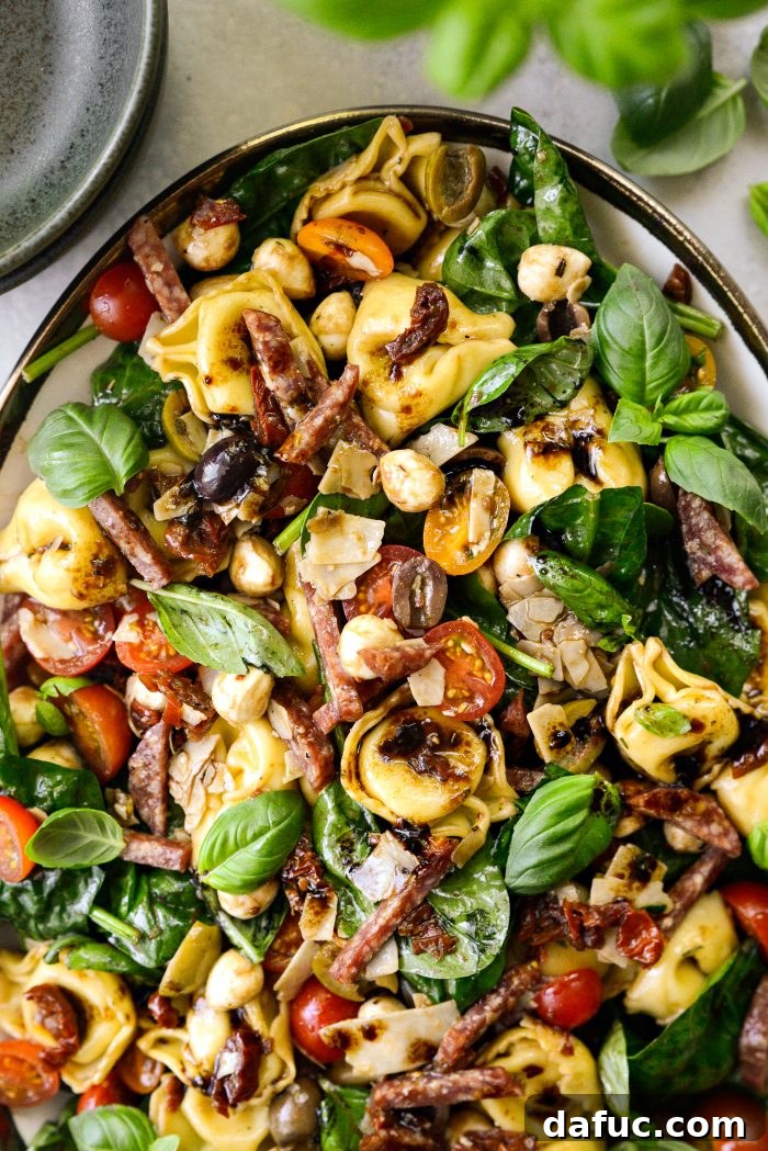 Rustic Tuscan Tortellini Salad 15 Tuscan Tortellini Pasta Salad in a decorative serving bowl