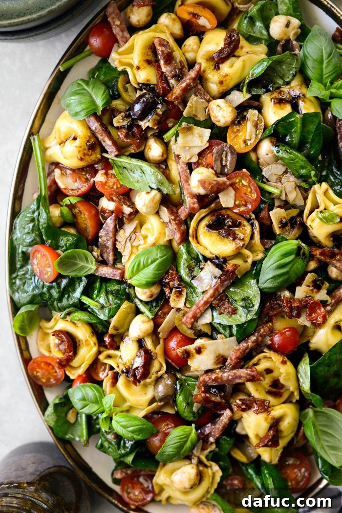Rustic Tuscan Tortellini Salad 16 Close-up of Tuscan Tortellini Pasta Salad with fresh basil garnish
