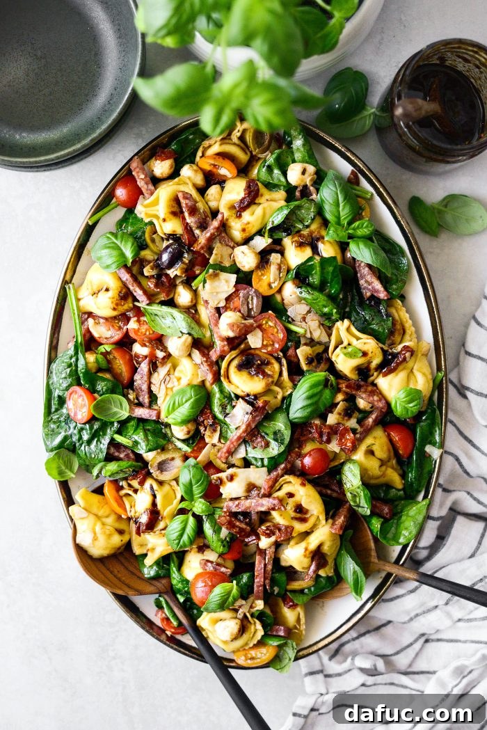 Rustic Tuscan Tortellini Salad 18 Tuscan Tortellini Pasta Salad in a bowl, ready to be enjoyed