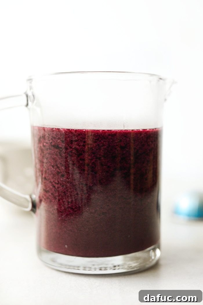 Finished homemade blueberry syrup in a jar
