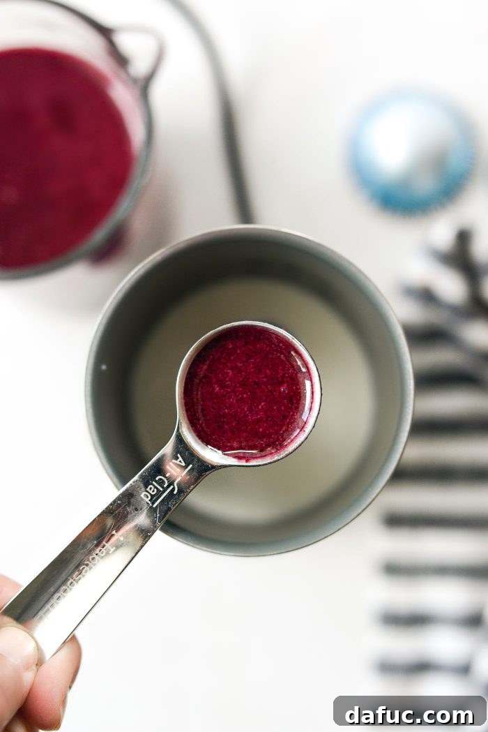 Ingredients for blueberry cold foam in a frother