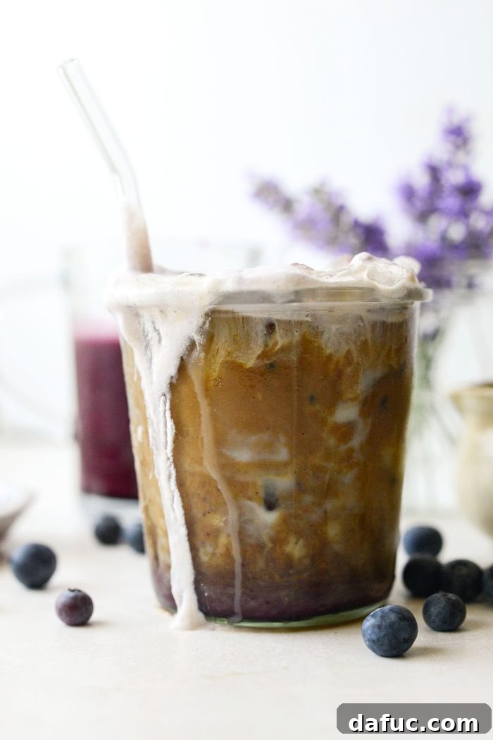 Iced Blueberry Latte with straw