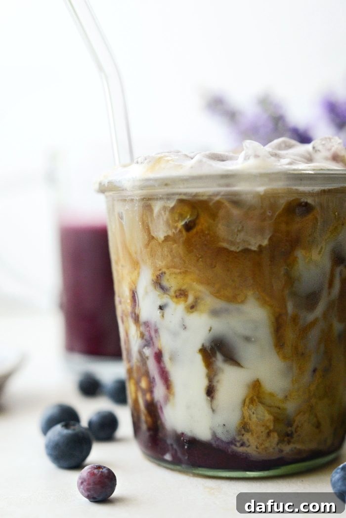 Iced Blueberry Latte with a spoon