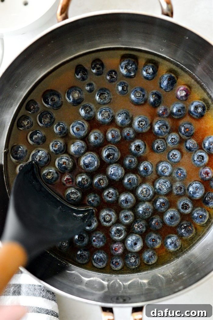 Stirring blueberry syrup ingredients