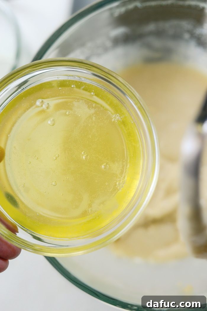Adding egg whites to the cake batter for a light and fluffy texture.