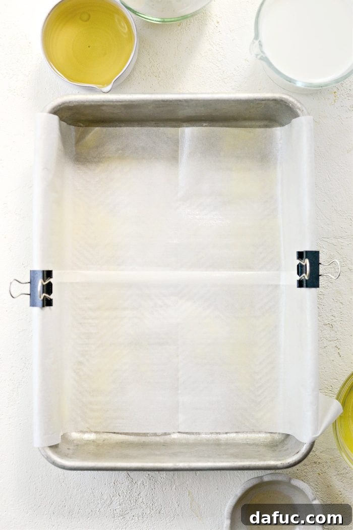 Preheating oven and lining a 9x13 cake pan