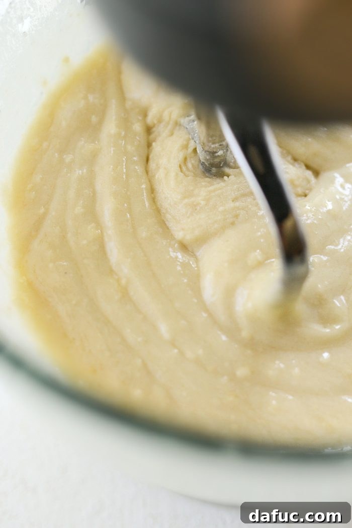 Mixing cake ingredients on medium-low speed until incorporated.