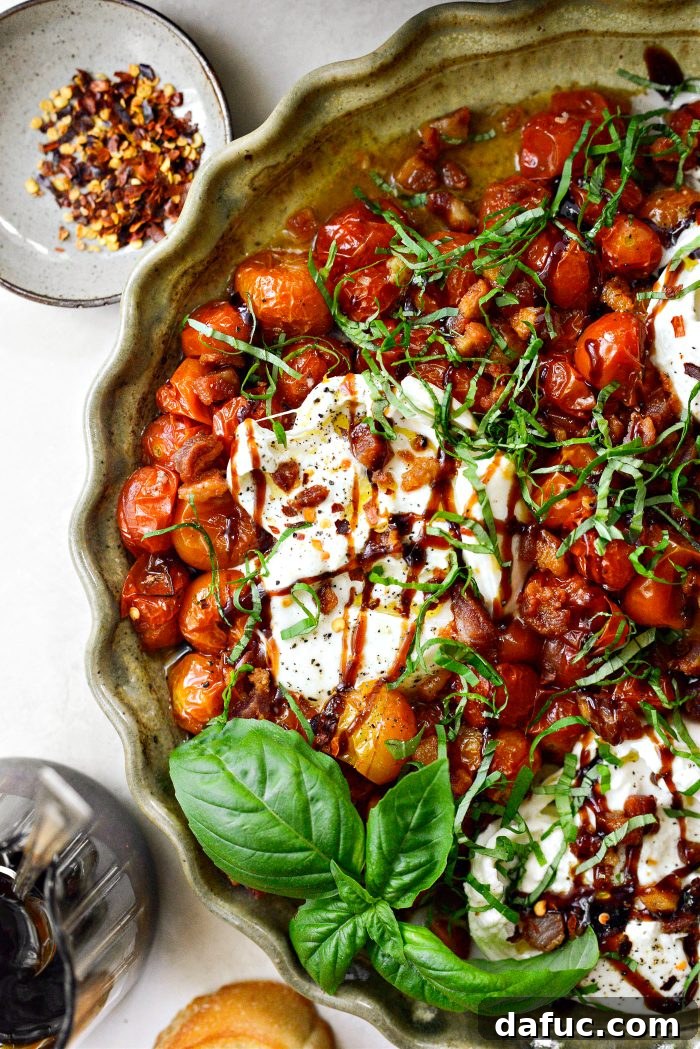 Sweet Blistered Tomatoes, Creamy Burrata, Crispy Pancetta 2 Blistered Tomatoes with Burrata and Pancetta - A gourmet appetizer with roasted tomatoes, burrata, and crispy pancetta.