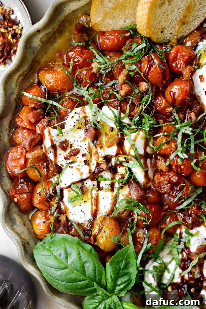 Sweet Blistered Tomatoes, Creamy Burrata, Crispy Pancetta 19 Hand scooping Blistered Tomatoes with Burrata and Pancetta onto a piece of crostini.
