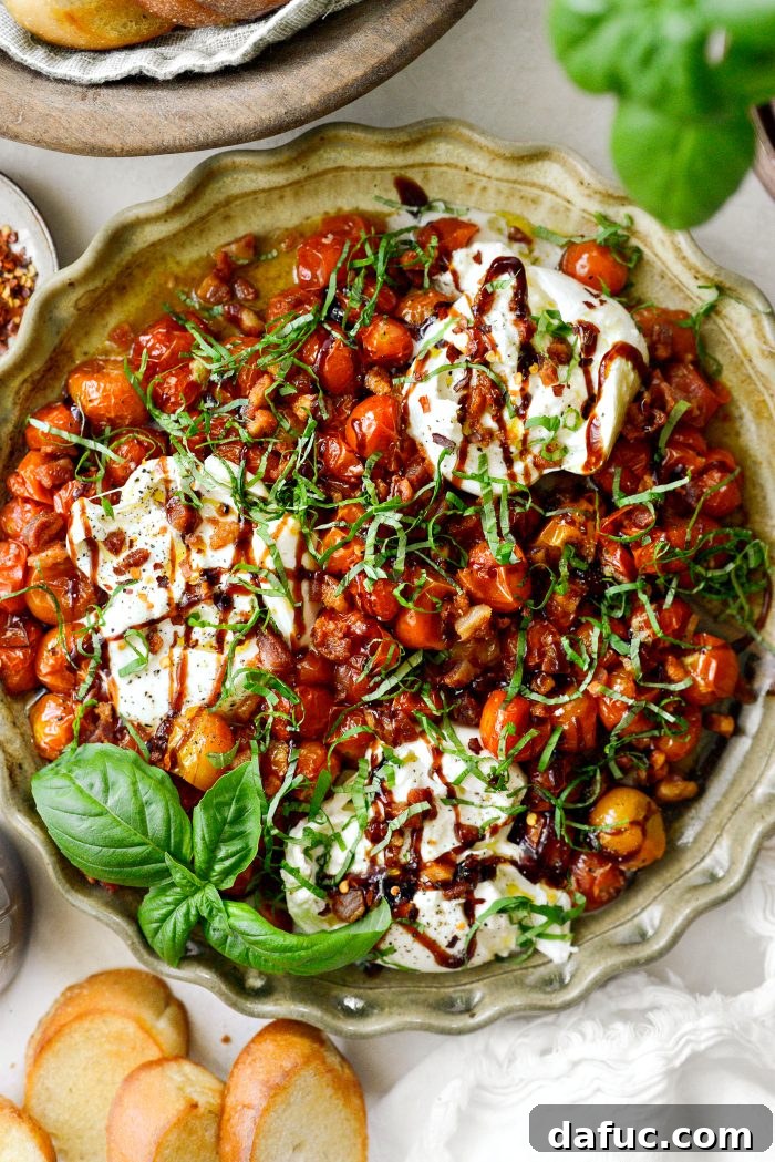 Sweet Blistered Tomatoes, Creamy Burrata, Crispy Pancetta 3 Blistered Tomatoes with Burrata and Pancetta on a serving platter, ready to be enjoyed.