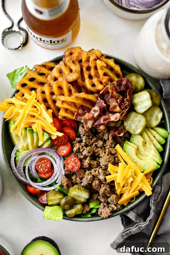 Ultimate Burger Bowl Creations 12 Building a loaded burger bowl with layers of ingredients