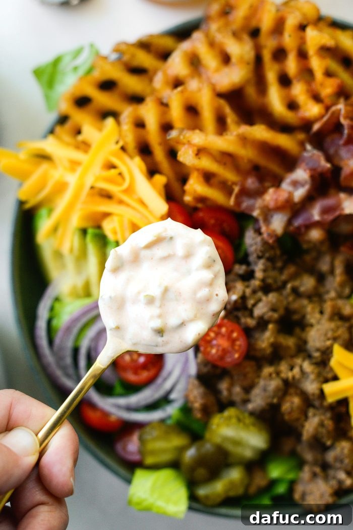 Ultimate Burger Bowl Creations 13 Drizzling Thousand Island dressing over a loaded burger bowl