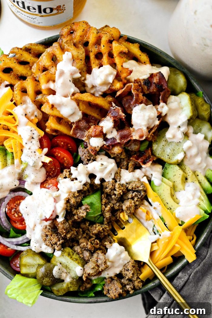 Ultimate Burger Bowl Creations 17 A person enjoying a Loaded Burger Bowl