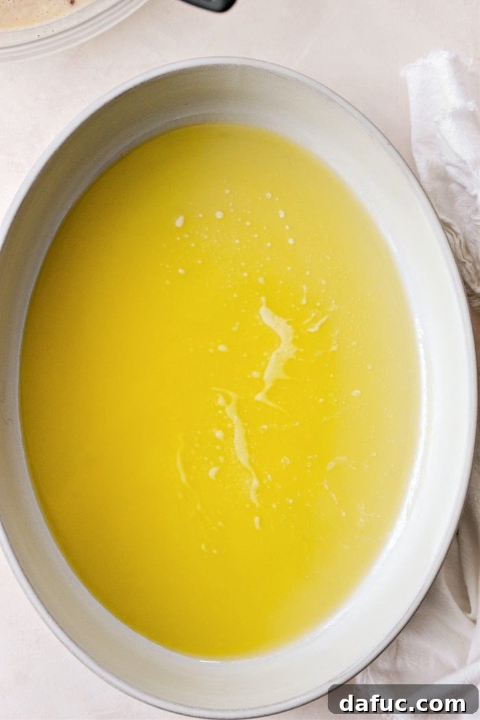 preheat oven and add melted butter to baking dish