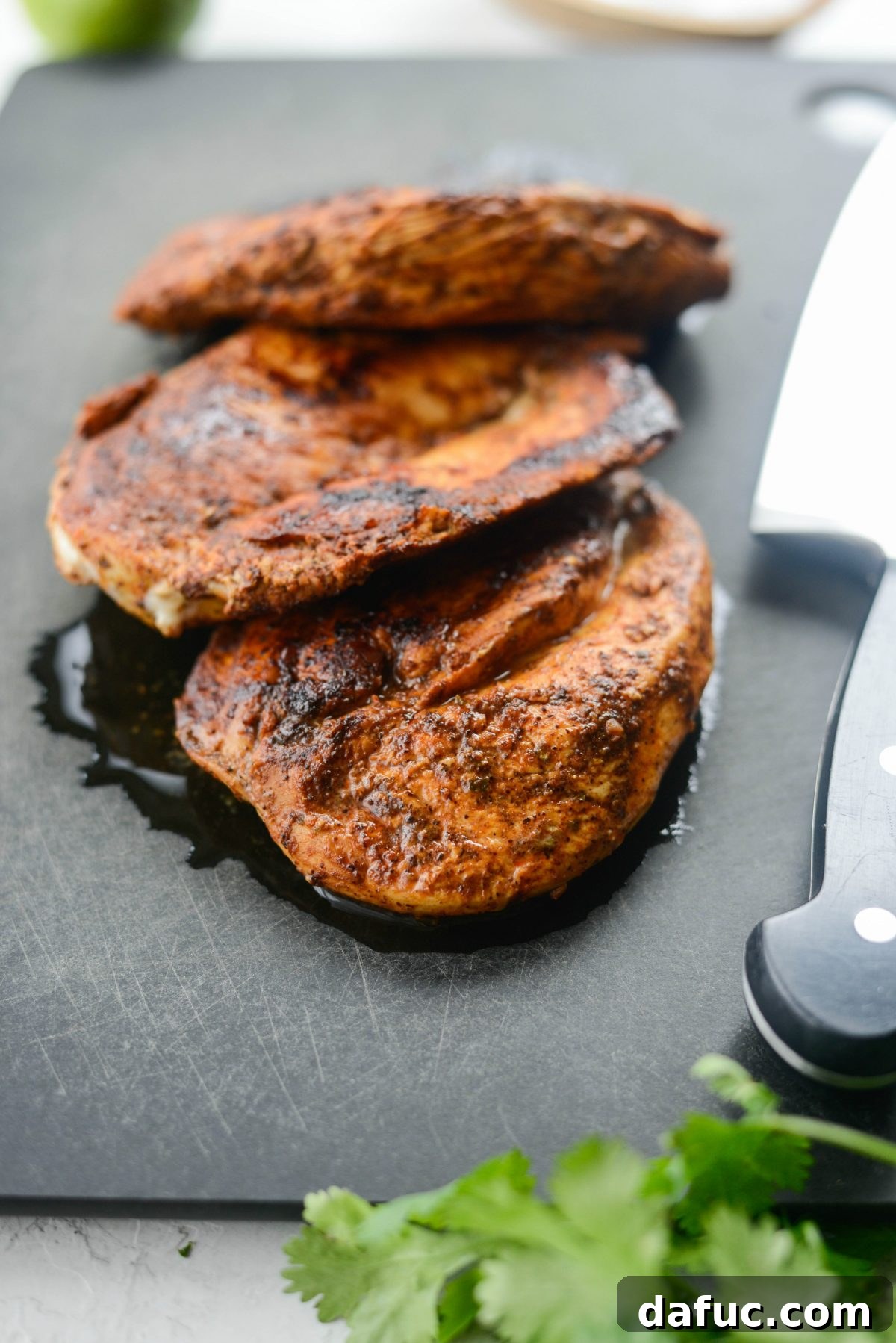 Smoky Chipotle Chicken Fajita Bowl 11 Searing chicken breasts in a hot skillet for fajitas