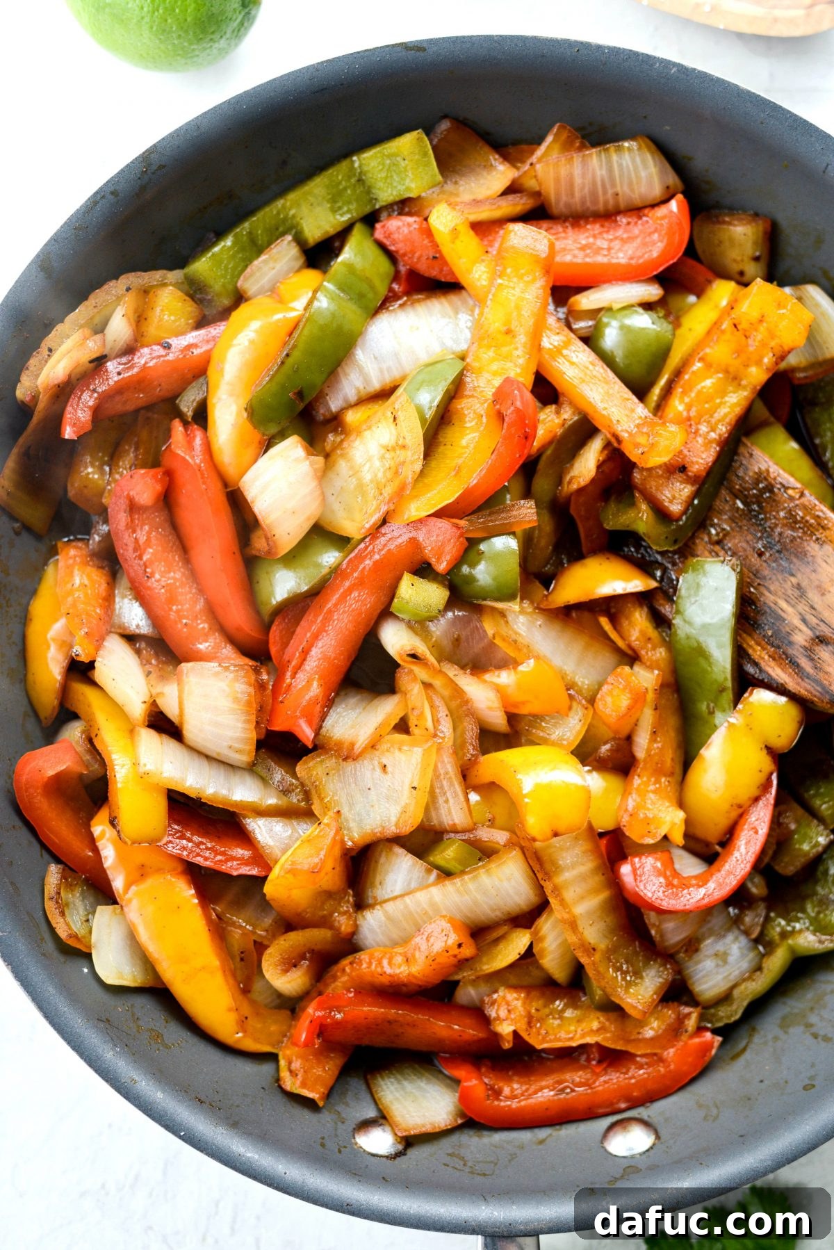 Smoky Chipotle Chicken Fajita Bowl 13 Colorful bell peppers and onions sizzling in a hot skillet
