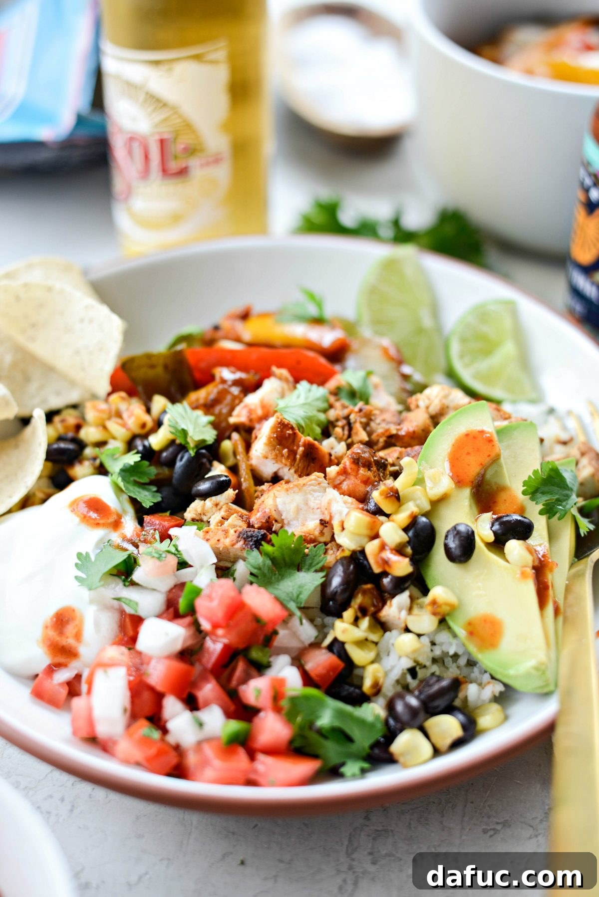 Smoky Chipotle Chicken Fajita Bowl 3 Close-up of a homemade Chipotle Chicken Fajita Rice Bowl with various toppings