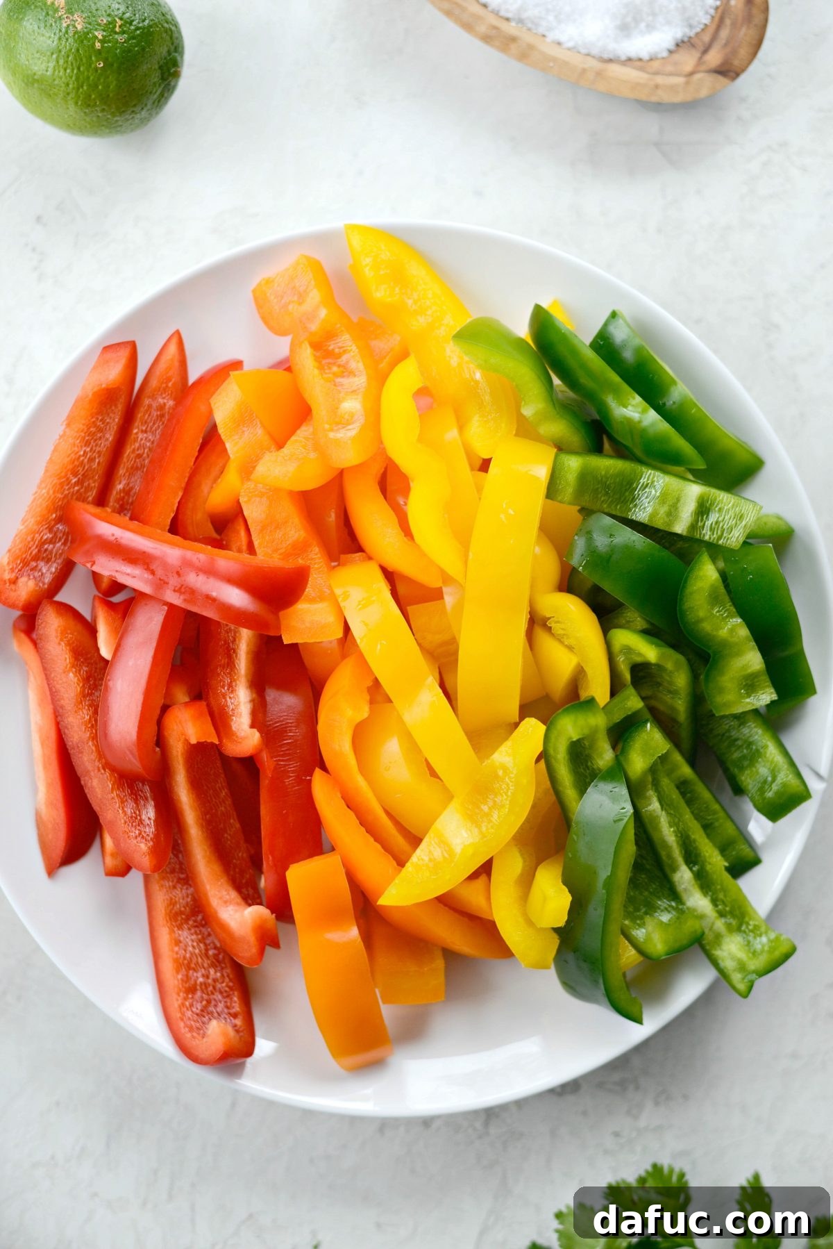 Smoky Chipotle Chicken Fajita Bowl 9 Fresh bell peppers and a sweet onion, sliced and ready for cooking
