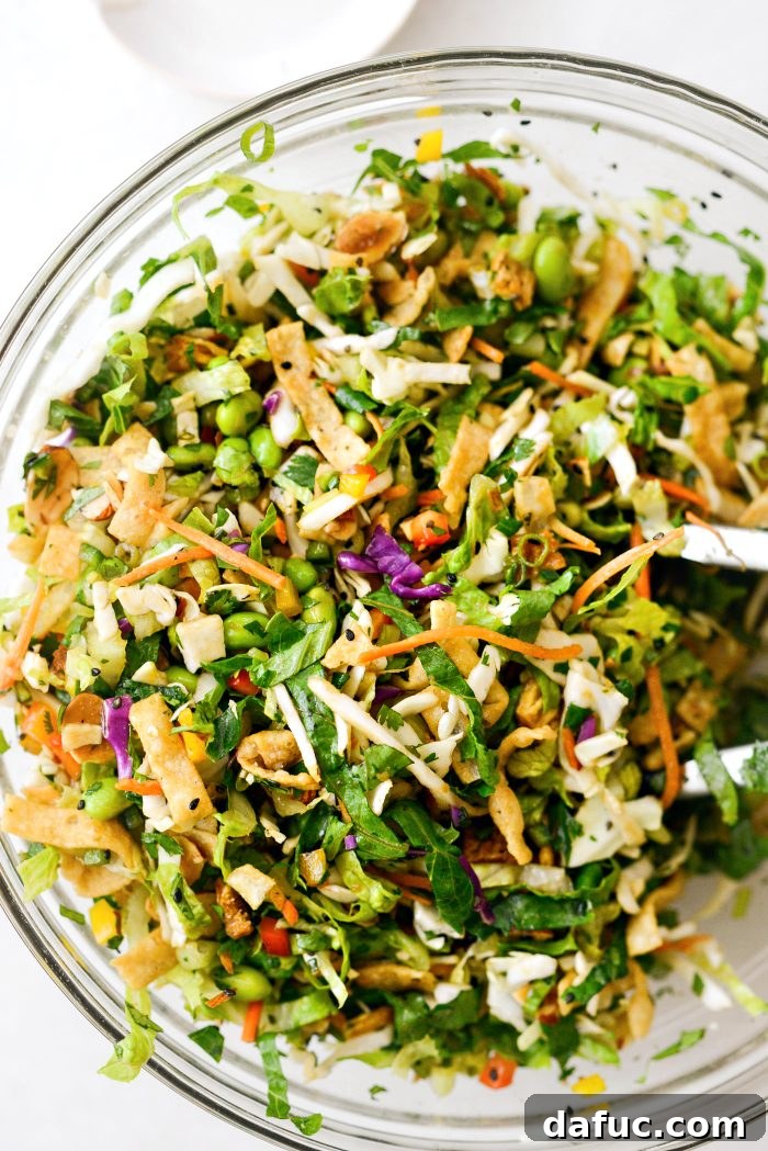 Tropical Teriyaki Salad 12 Final toss to combine dressing and wontons