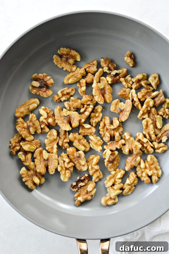 Toasted walnuts in a skillet