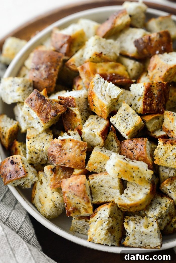 Golden Crispy Homemade Croutons 11 An overhead shot showcasing a beautiful bowl of golden homemade croutons against a rustic background