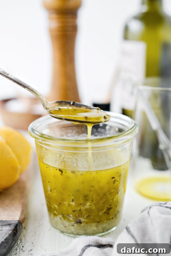 Homemade Greek Dressing in a jar, ready to be served