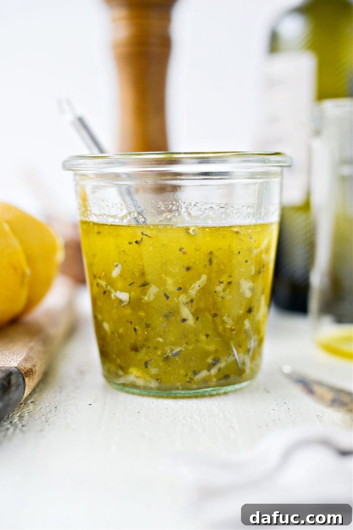 Beautifully emulsified homemade Greek dressing in a glass jar
