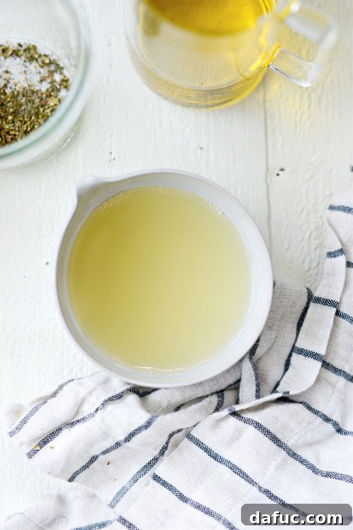 Freshly strained lemon juice in a glass, free of seeds and pulp