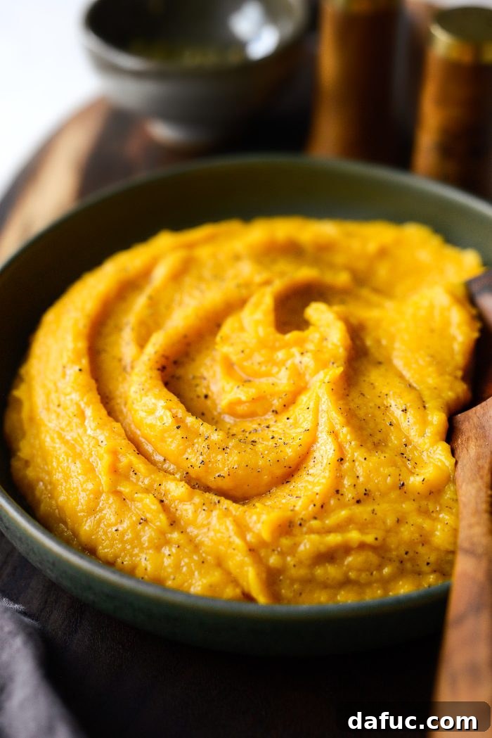 Roasted Garlic Golden Squash Whip 14 Garnished Roasted Garlic Whipped Butternut Squash on a serving plate