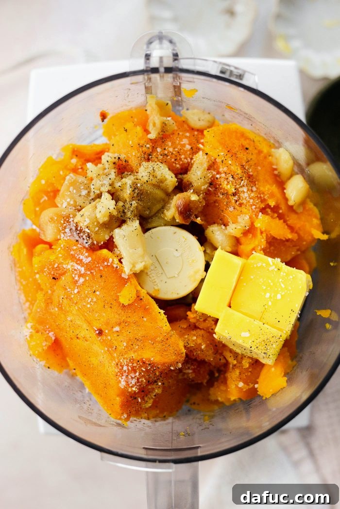 Roasted Garlic Golden Squash Whip 9 Adding roasted squash, garlic, butter, salt, and pepper to a food processor