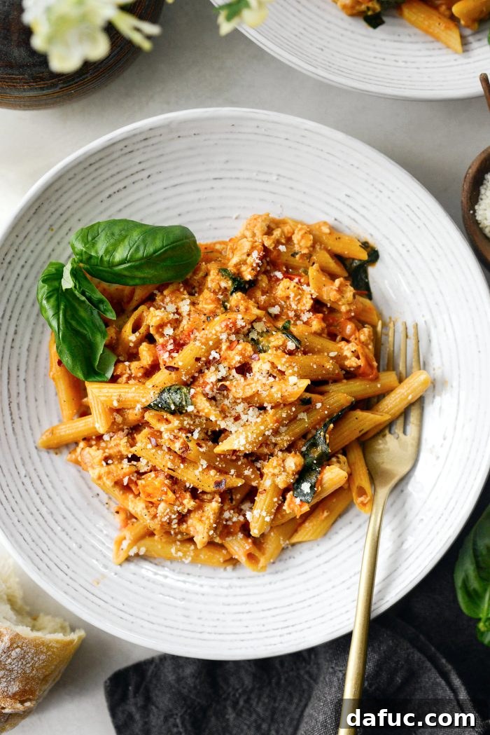 Delicious Cheesy Chicken One Pot Pasta served in a skillet
