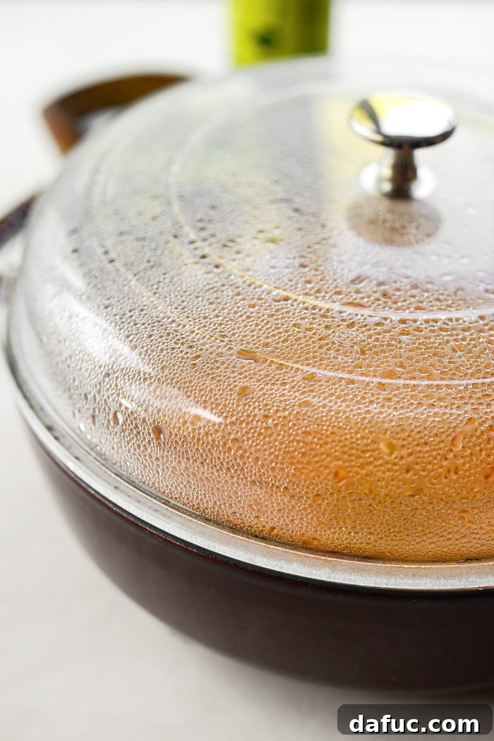 Skillet covered and brought to a boil