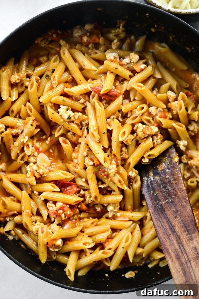 Uncovered skillet, reducing heat to simmer until pasta is tender