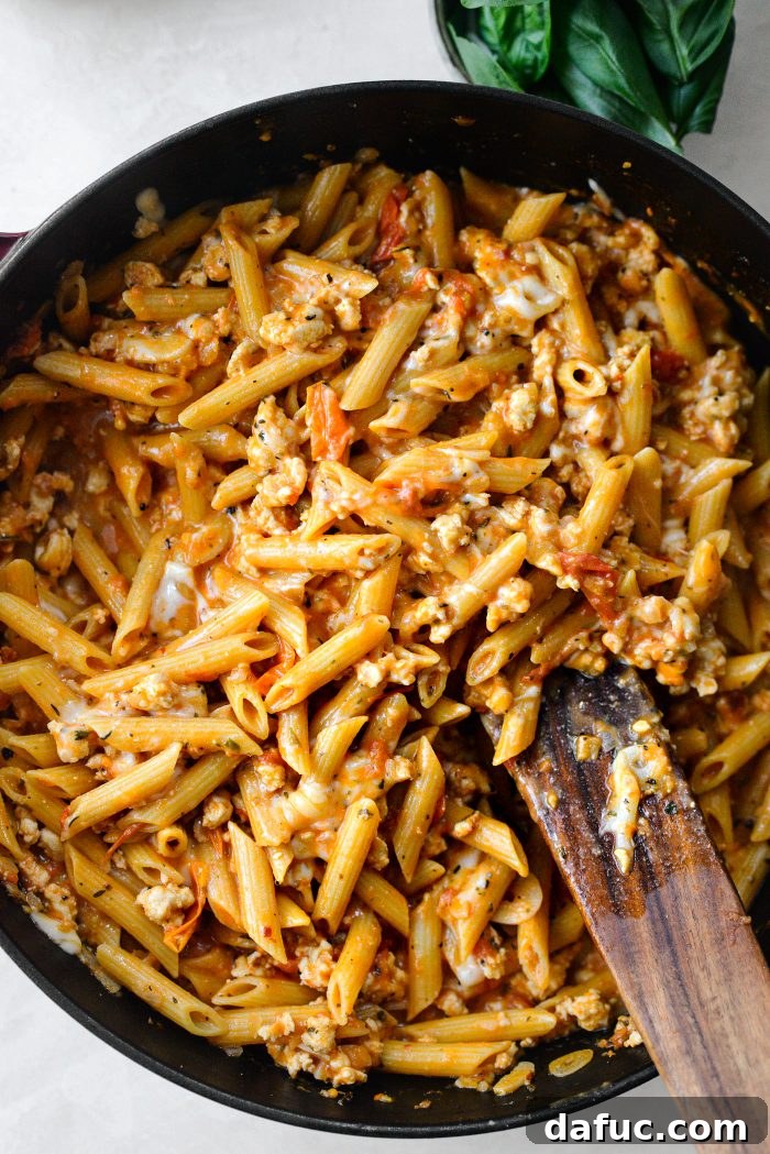 Stirring until cheese is melted and creamy