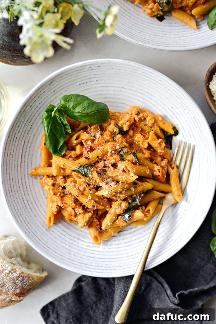 Cheesy Chicken One Pot Pasta with a side of garlic bread