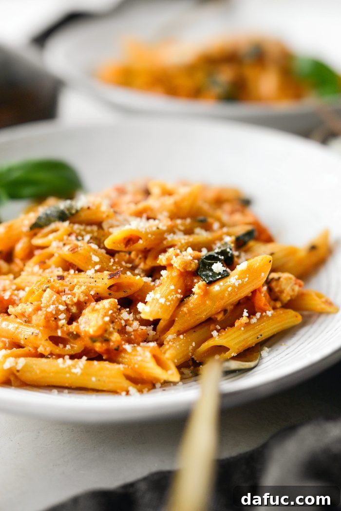 Close-up of creamy Cheesy Chicken One Pot Pasta in a pan