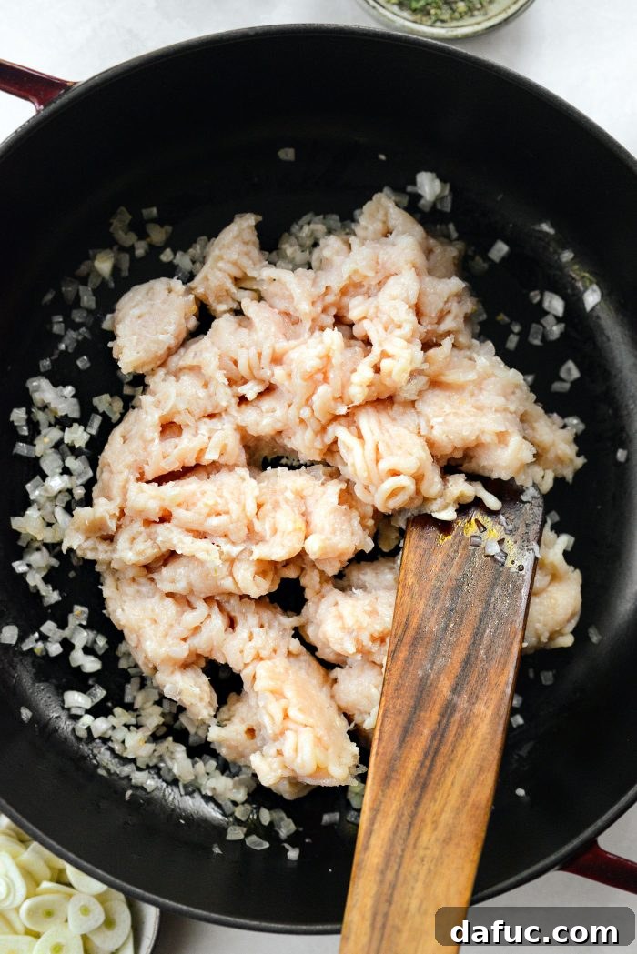 Ground chicken added to sautéed shallots