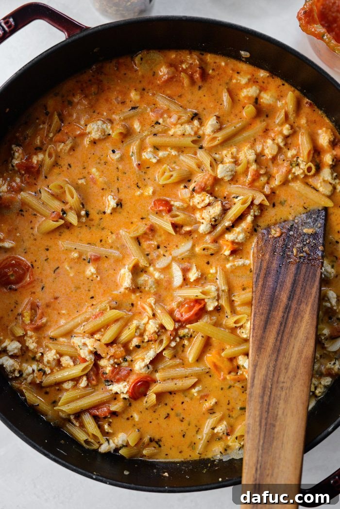 Stirring to combine all ingredients in the pan