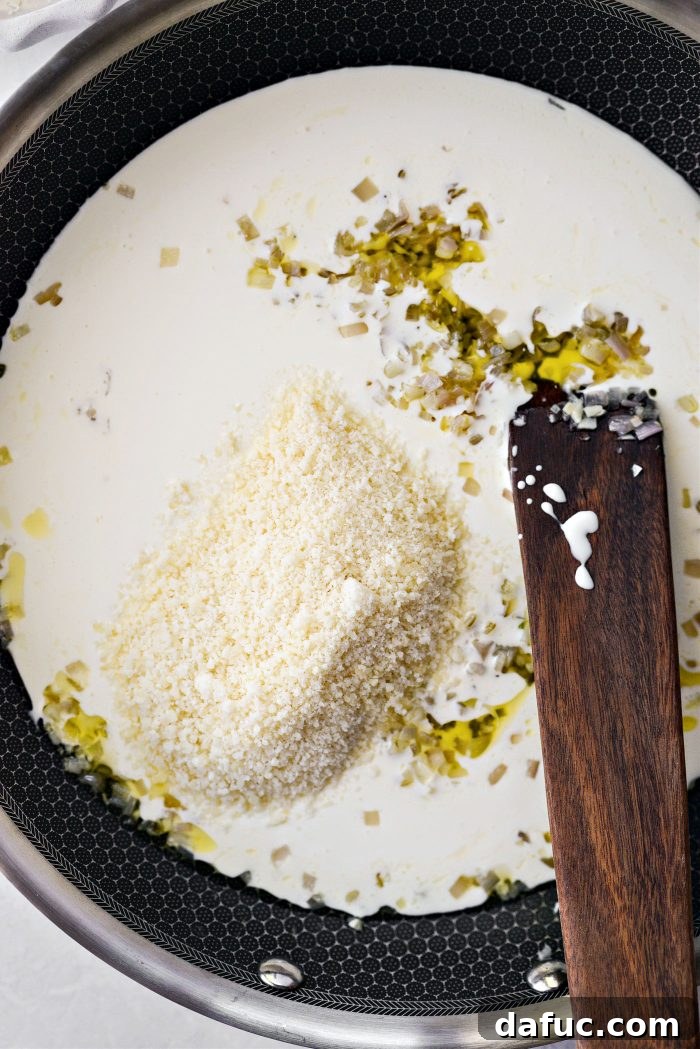 pour in cream and add in parmesan cheese