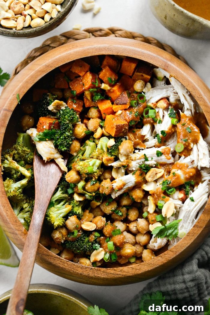 Peanut Chicken Sweet Potato and Broccoli Bowls in a wider shot