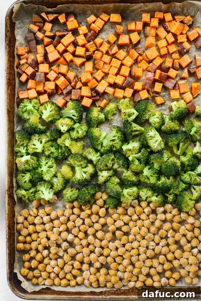 Roasted vegetables and chickpeas on a baking sheet