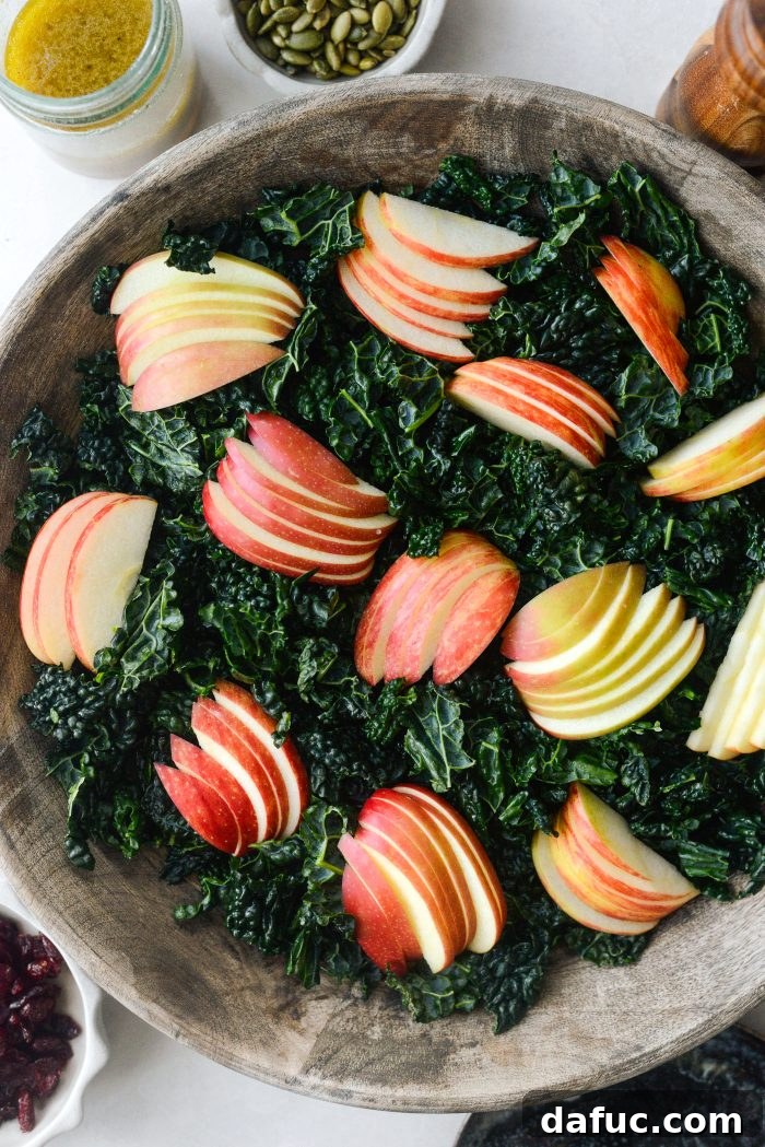 Honeycrisp Apple and Crispy Pancetta Kale Salad with Manchego 14 transfer kale to bowl and add apple slices