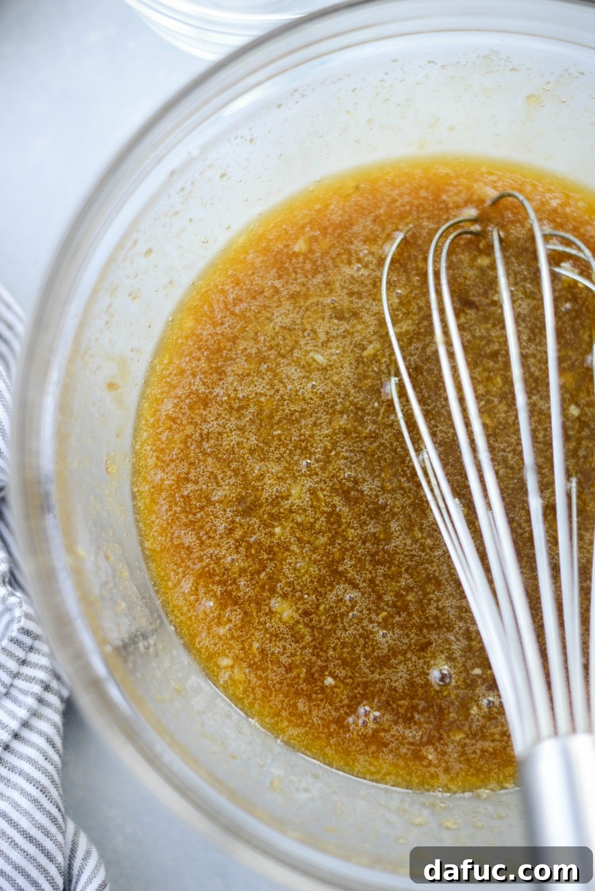 Irresistible Classic Pecan Pie 12 Whisking one last time to combine all ingredients.