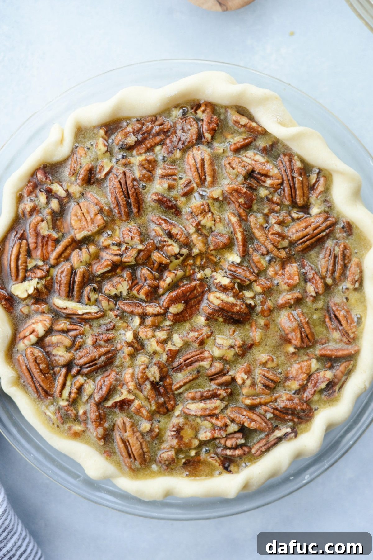 Irresistible Classic Pecan Pie 16 Baking the pecan pie in the oven.