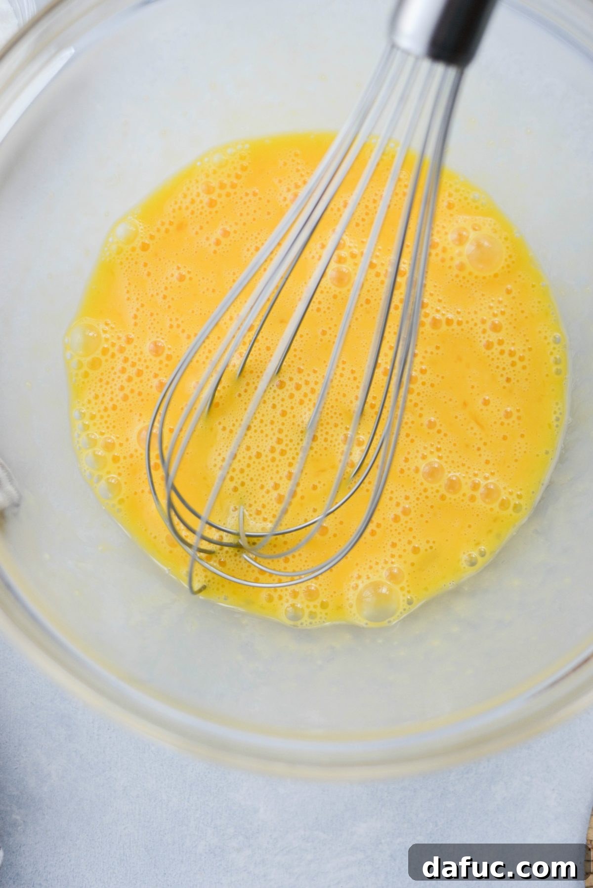 Irresistible Classic Pecan Pie 6 Whisking eggs to combine.