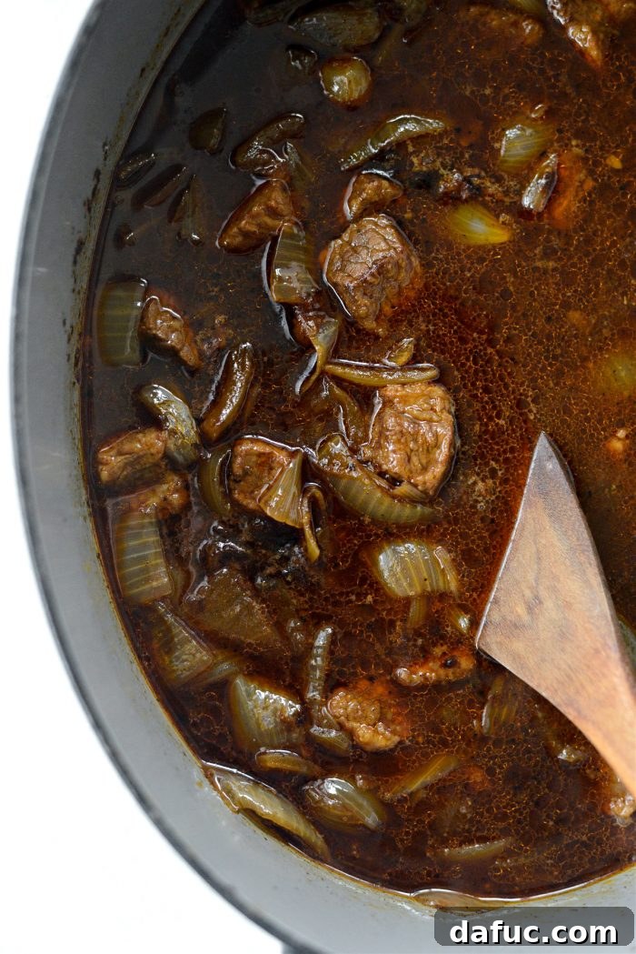 Guinness-Infused Irish Beef Stew 24 Stirring the stew during simmering