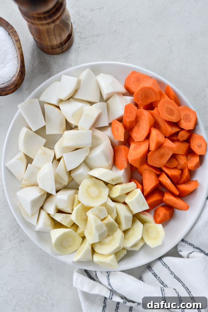Guinness-Infused Irish Beef Stew 25 Plate of chopped carrots, parsnips, and turnips ready for the stew