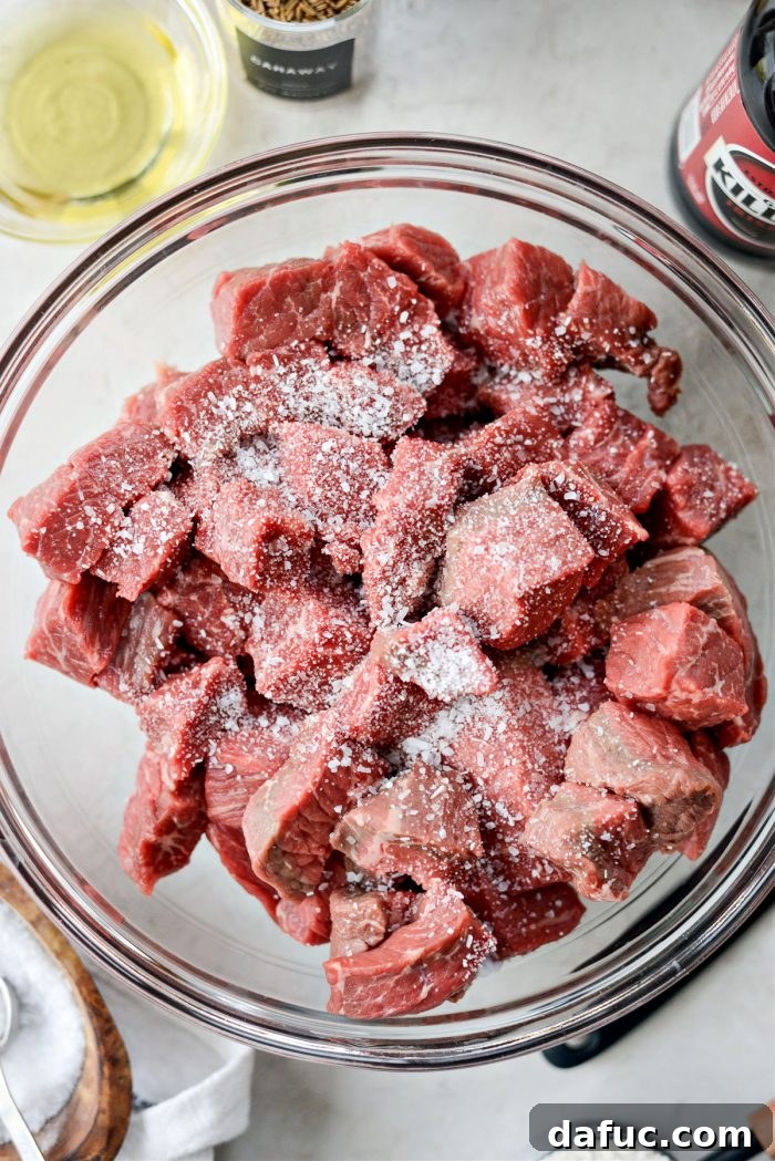 Guinness-Infused Irish Beef Stew 7 Seasoning beef with kosher salt for Irish stew