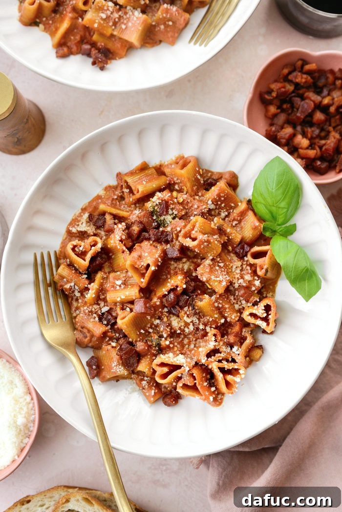 Creamy Blush Pasta 24 Pink Pasta Sauce garnished with fresh basil and parmesan